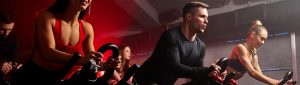 Group of people exercing on a stationary cycle demostrating CicloZone, an indoor cycling app, redifining indoor cycling