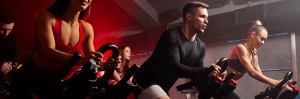 Group of people exercing on a stationary cycle demostrating CicloZone, an indoor cycling app, redifining indoor cycling